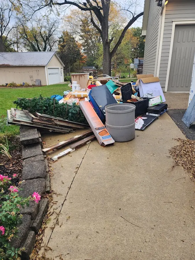 Dumpster being loaded with debris for 3 Yard Dumpster Rental in Raymondville